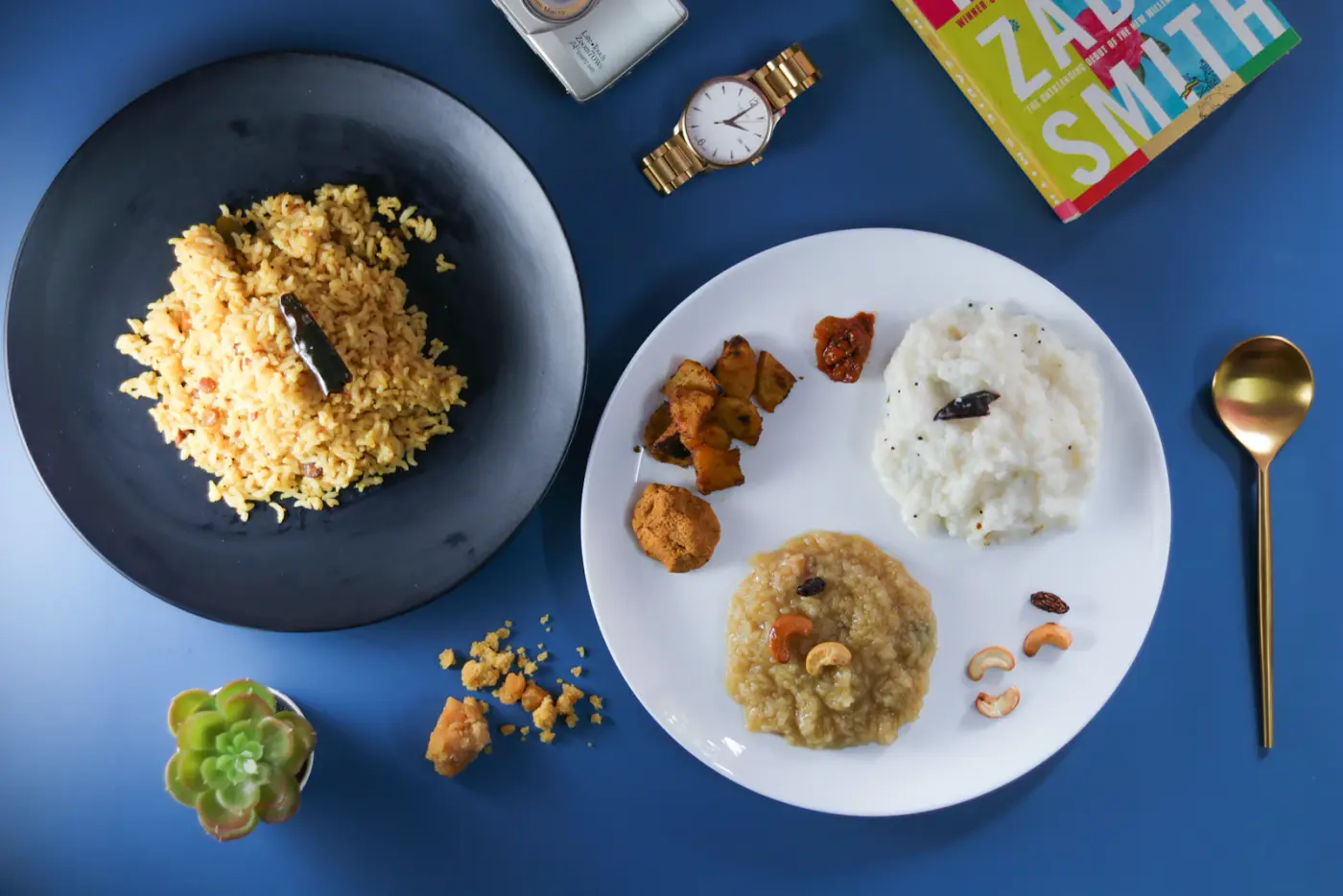 A generous Indian meal with colourful curries, breads and rice for sharing