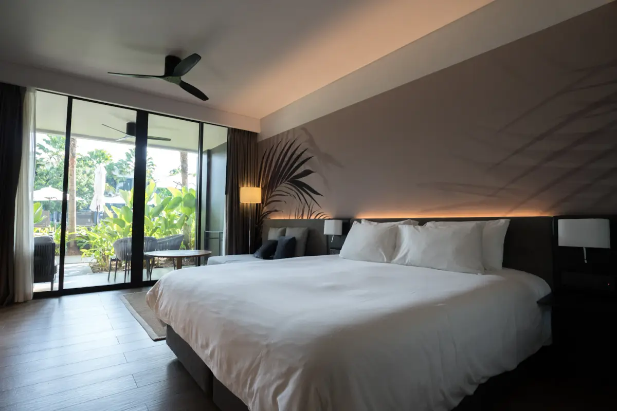 Spacious contemporary hotel room representative of a comfortable stay